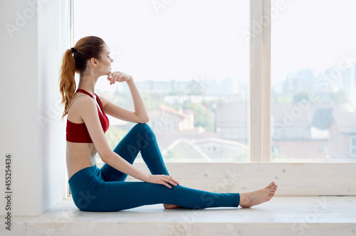 woman sitting near the window recreation sport workout