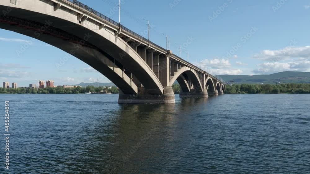 The Communal bridge of Krasnoyarsk during sunny summer day. Yenisei river and Communal bridge. Video 4k resolution The Communal bridge of Krasnoyarsk during sunny summer day. Yenisei river and Communal bridge. Video 4k resolution