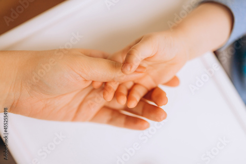 hands of mother and child, soft focus, selective focus