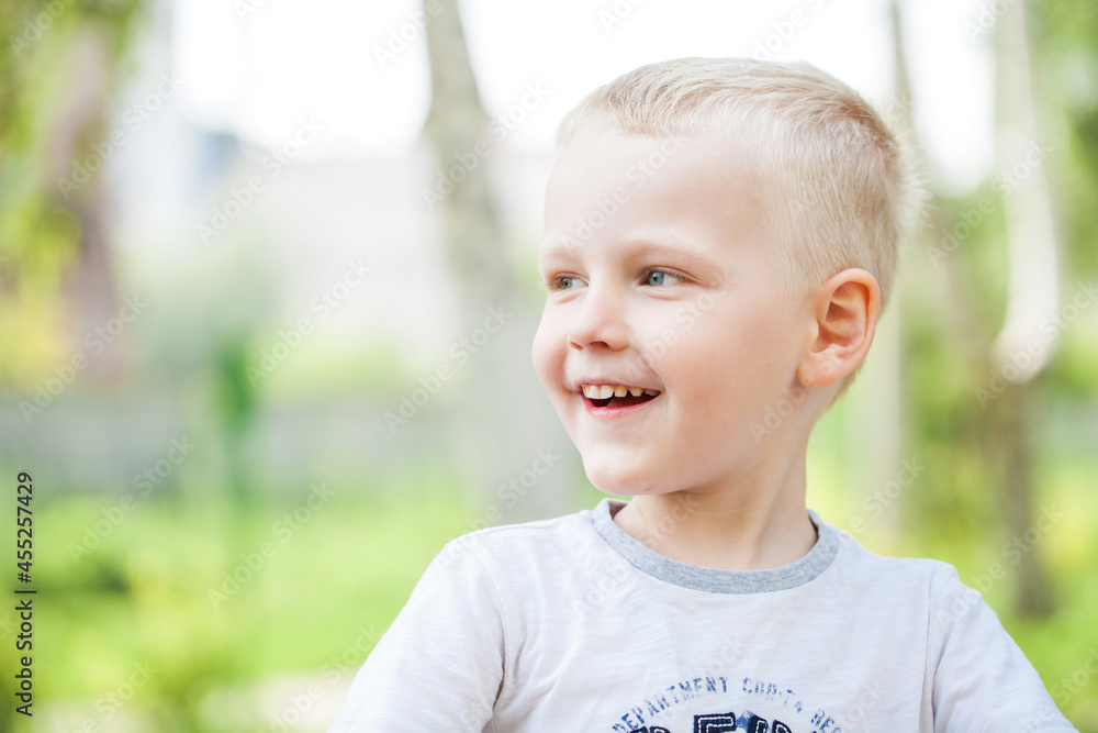 Blonde little boy in a summer park Blonde little boy in a summer park