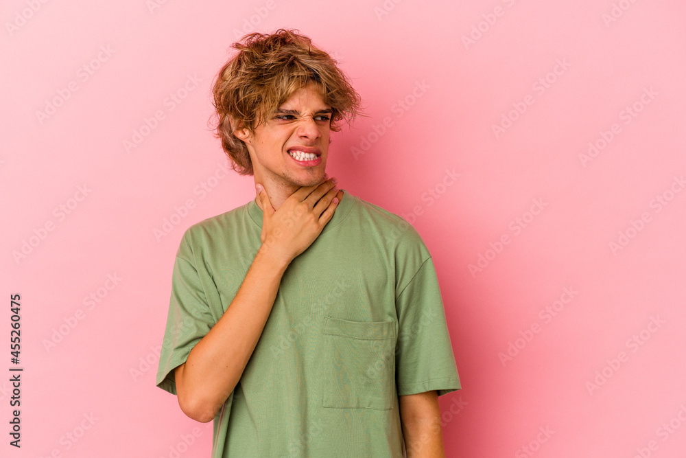 Young caucasian man with make up isolated on pink background touching back of head, thinking and making a choice. Young caucasian man with make up isolated on pink background touching back of head, thinking and making a choice.