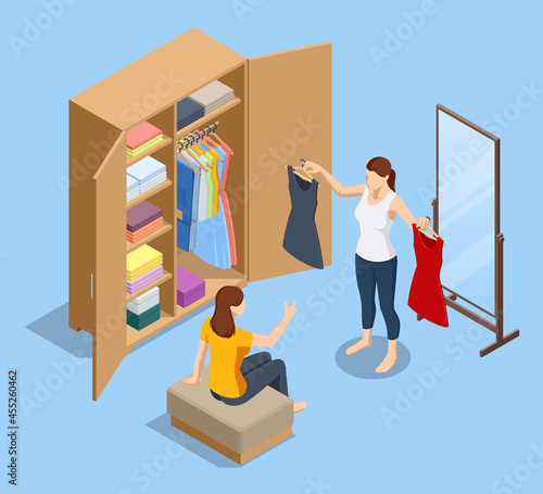 Isometric girl stands near an open wardrobe and chooses clothes. Woman tries on clothes and looks in the mirror