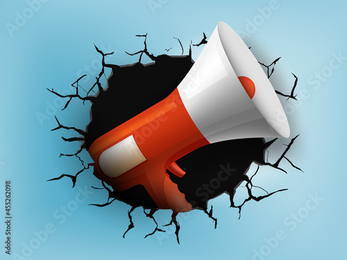 Megaphone from a hole with cracks in the wall.