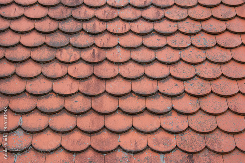 Red wooden tiles. Exterior panels. Retro texture