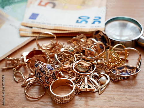 many golden and silver jewerly and money, pawnshop concept, jewerly shop concept