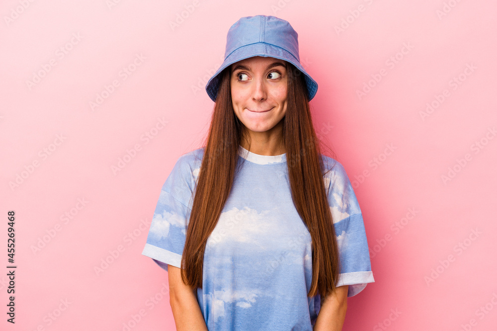 Young caucasian woman isolated on pink background confused, feels doubtful and unsure. Young caucasian woman isolated on pink background confused, feels doubtful and unsure.