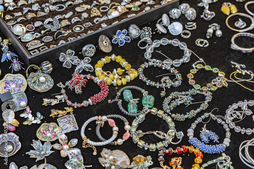 A street vendor's shopping counter with retro jewelry and old vintage bijouterie