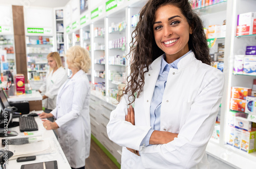 Portrait of female pharmacist in drugstore. photo