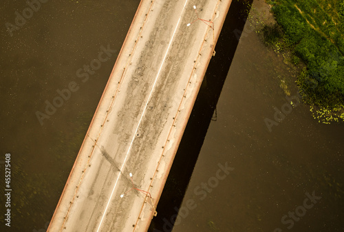 Aerial view of young bridge over Venta river, Kuldiga, Latvia.