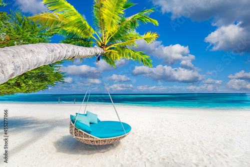Tropical island beach, luxury summer landscape beach swing or hammock on palm tree with white sand calm seaside for beach banner. Amazing scenic beach vacation and summer holiday, relax chill mood
