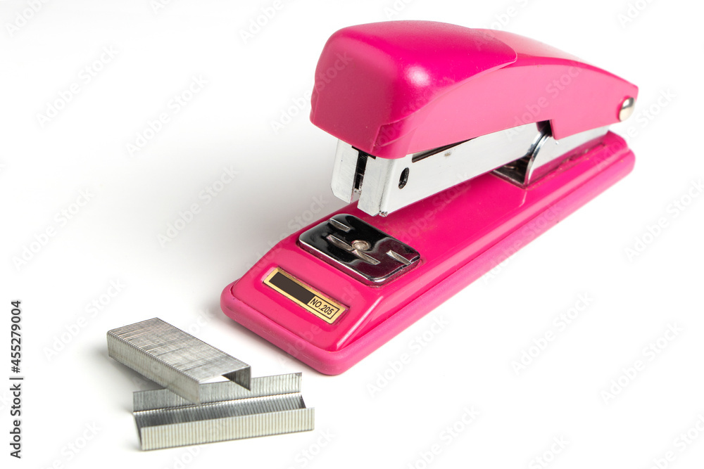Stapler and metal staple concept over white background Stapler and metal staple concept over white background
