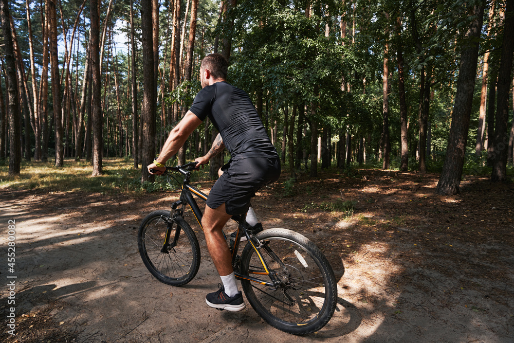 Athletic man riding at fast speed in nature Athletic man riding at fast speed in nature