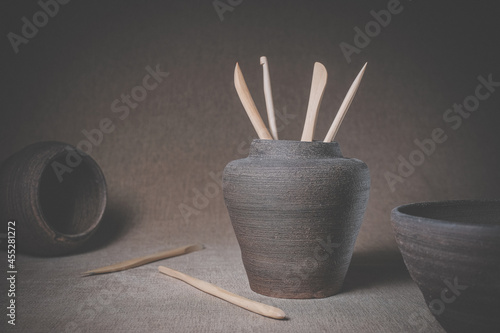 Clay jugs and sculptural stacks on the table