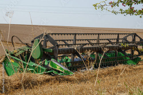 John Deere 24' harvester equipment awaiting the replacement combine on Salisbury Plain Wiltshire UK photo