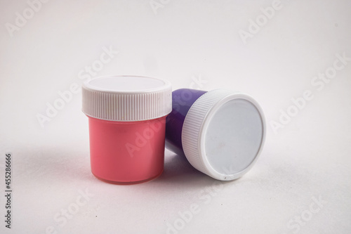 Jars of paint on a white background