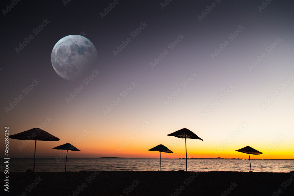 Empty beach view with umbrella silhouette Empty beach view with umbrella silhouette