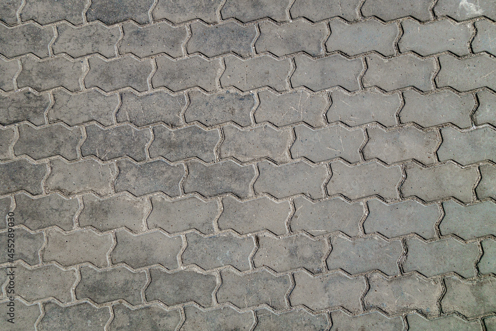Urban street tiled pavement of grey color, texture or background Urban street tiled pavement of grey color, texture or background