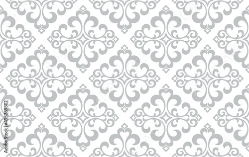 Wallpaper in the style of Baroque. Seamless vector background. White and gray floral ornament. Graphic pattern for fabric, wallpaper, packaging. Ornate Damask flower ornament.