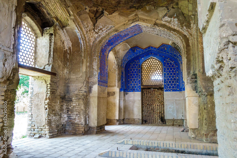 Room in Ishratkhona mausoleum, Samarkand, Uzbekistan. Built in 1464 for women from Timurid dynasty. Crypt on lower right. Interior was richly decorated as can be seen from partially restored decor
