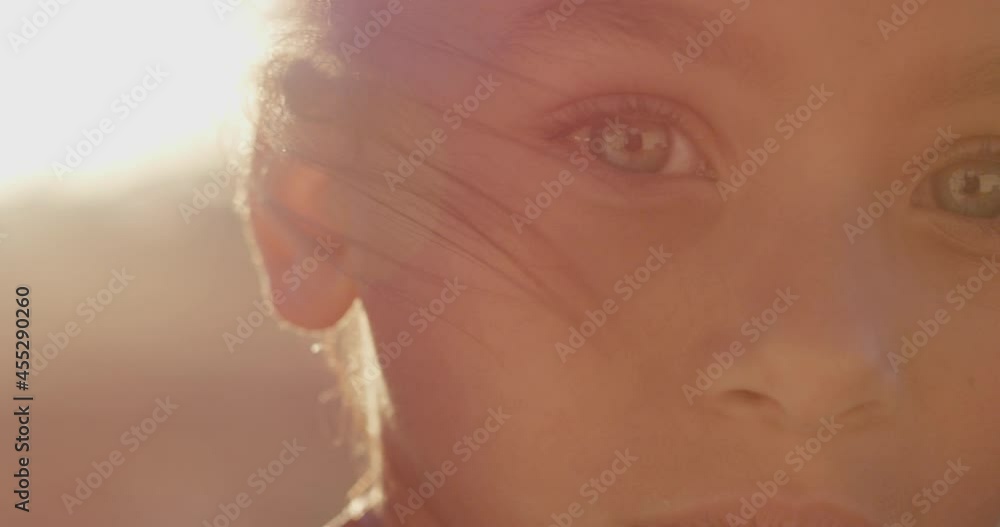 Portrait of mixed race girl child smiling outdoors at sunset Portrait of mixed race girl child smiling outdoors at sunset
