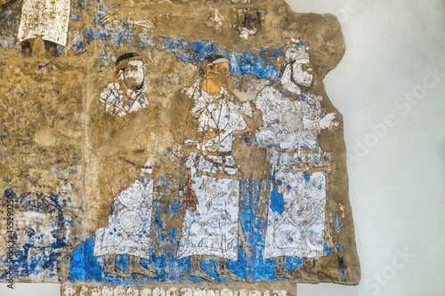 Antique fresco of VII-VIII AD from Central Asia from Ishkhid palace. Courtiers are depicted. Clothing contains individual symbols that later became traditional. Afrasiab Museum, Samarkand, Uzbekistan