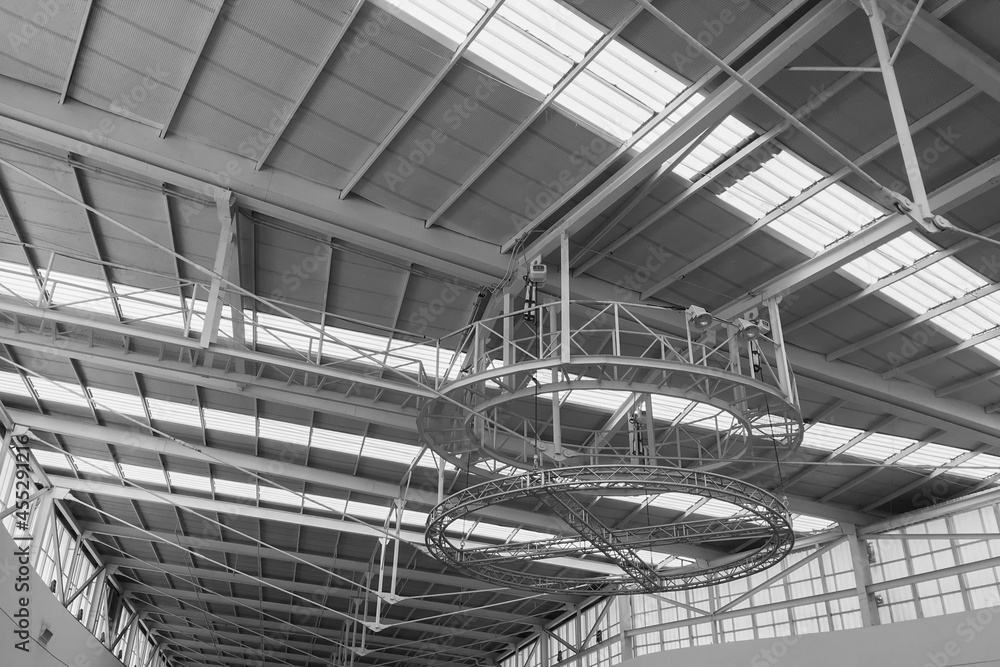 Interior architecture space and light atmosphere show long span steel structure roof with strip of skylight in black and white.