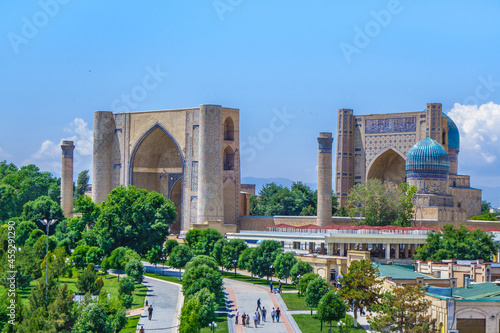 Panorama of Bibi-Khanym mosque complex in Samarkand, Uzbekistan. You can see alley and people walking photo
