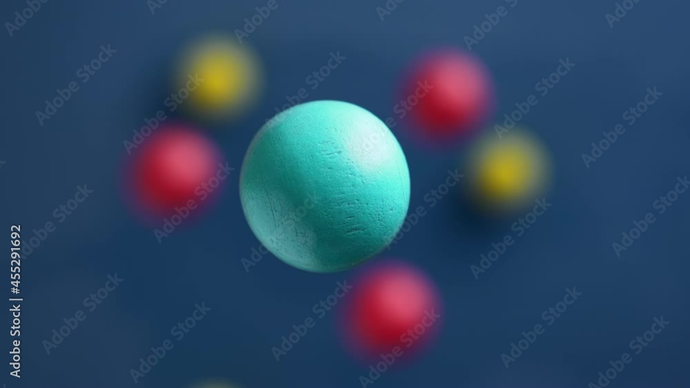 Blue, red and yellow balls are moving on a blue background, 3D effect. Bright abstract background with spherical shapes. Blue, red and yellow balls are moving on a blue background, 3D effect. Bright abstract background with spherical shapes.
