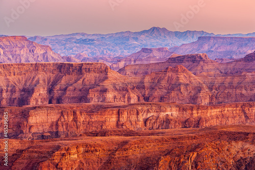 Colorful eroded walls of the Fish River Canyon in Namibia after sunset