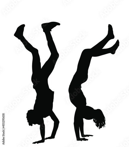 Athlete man and woman, hand stand couple in love vector silhouette illustration isolated on white. Acrobat girl and boy upside down fun entertainment. Sport activity with strong hands and balance.