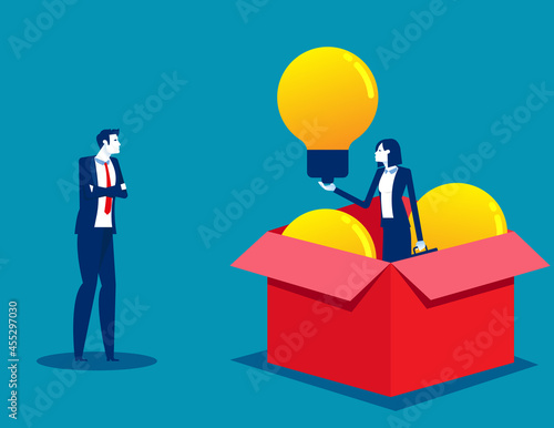 Successful business person holds idea lightbulb. Open cardboard box