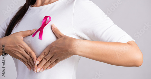 Wallpaper Mural Closeup of pink badge ribbon on woman chest to support breast cancer cause. Healthcare, medicine and breast cancer awareness concept. Torontodigital.ca