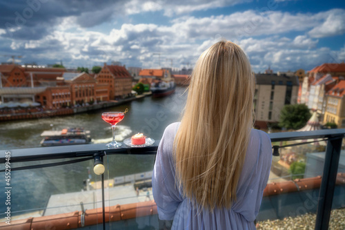 View from the tars to the old town of Gdańsk, the girl admires the city, Poland 