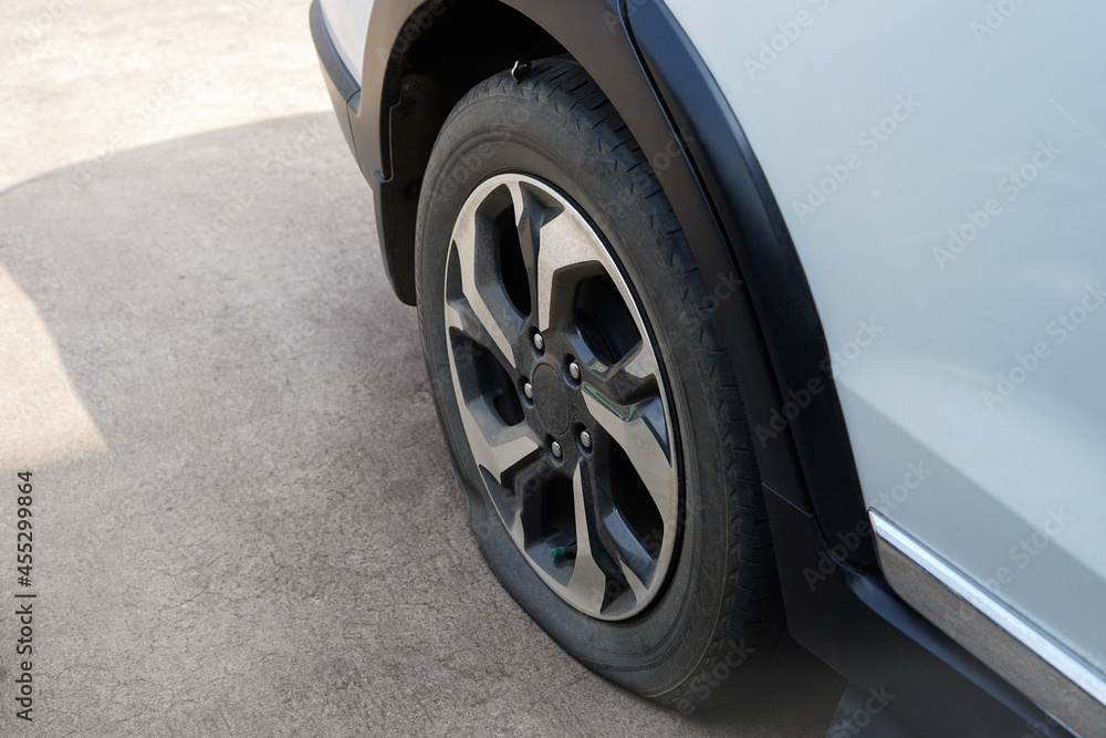 flat car tire parked on the street