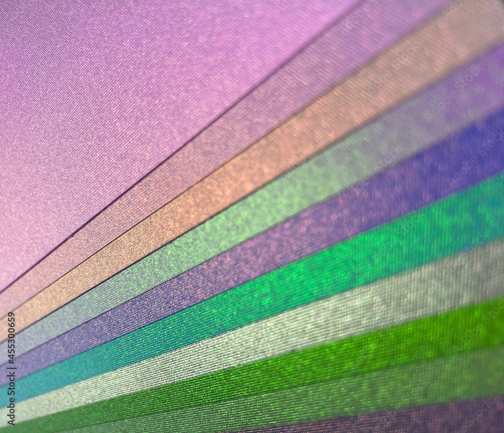 Fototapeta premium Shimmer duochrome holographic coloured diagonal stripes bokeh abstract background