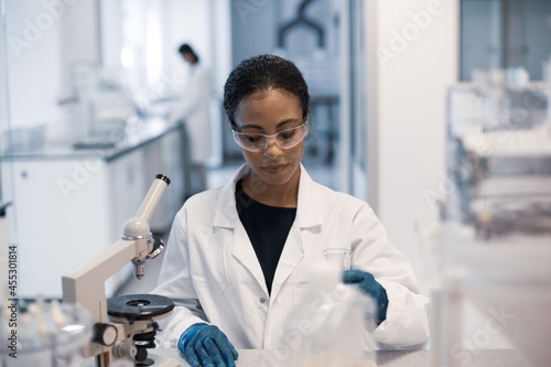 African American female scientist working in a science laboratory photo