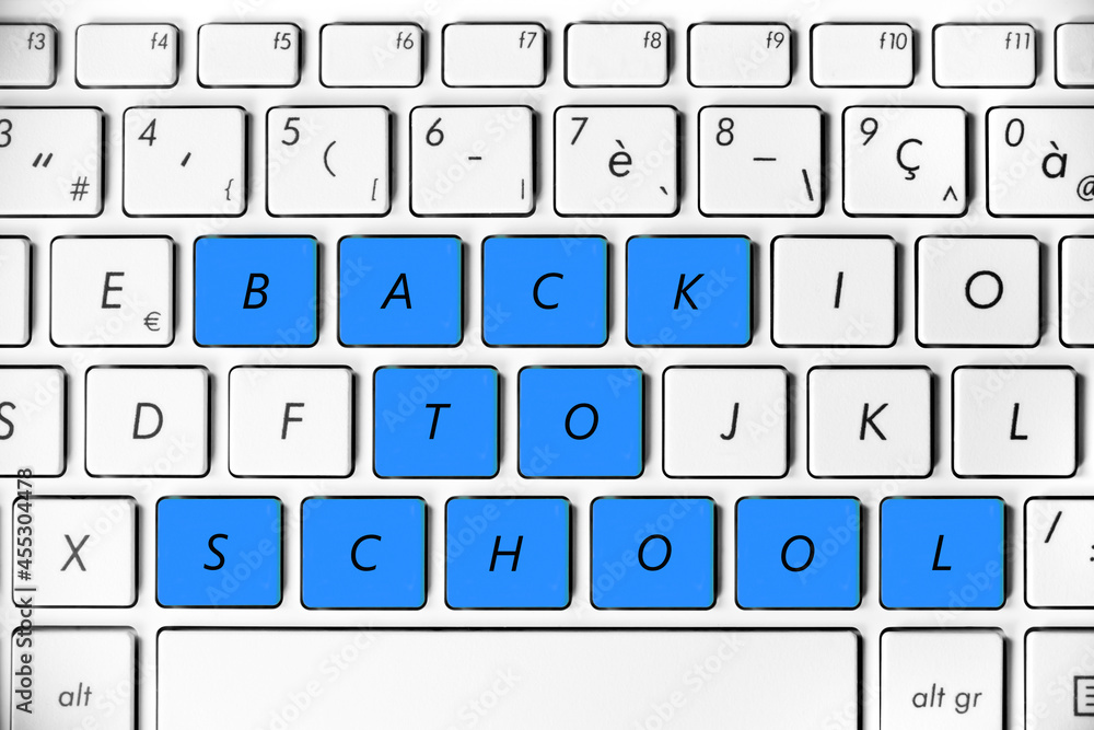 Back to school written on a computer keyboard, online study concept Back to school written on a computer keyboard, online study concept