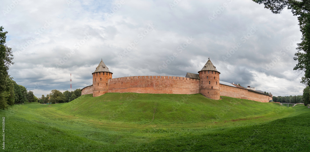 Panorama view of walls and Fyodorovskaya and Mitropolichya towers of Novgorod Kremlin. Summer cloudy day in Veliky Novgorod, Russia.