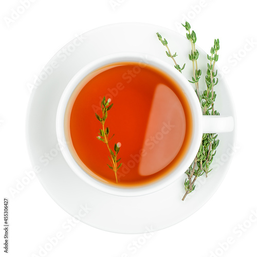 cup of tea with thyme on isolated white background, top view