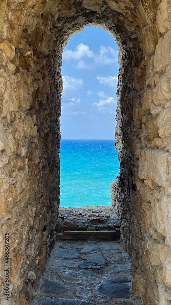 View through embrasure of fortress wall of Enetikón Froúrion Rocca a Mara Greece Crete onto the Gulf of Heraklion
