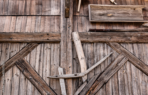 Detail of rustic wooden door with decorations