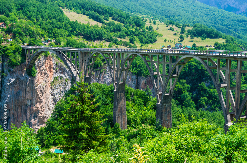 Concrete arch Durdevica Tara Bridge over Tara Canyon River in northern Montenegro. Concrete arch Durdevica Tara Bridge over Tara Canyon River in northern Montenegro.