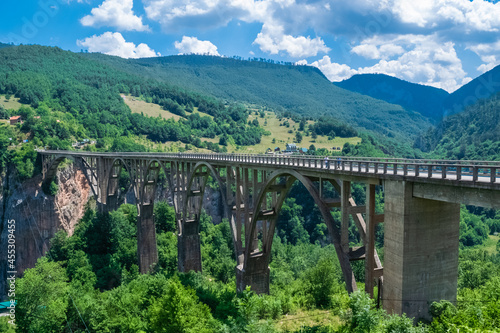 Concrete arch Durdevica Tara Bridge over Tara Canyon River in northern Montenegro.