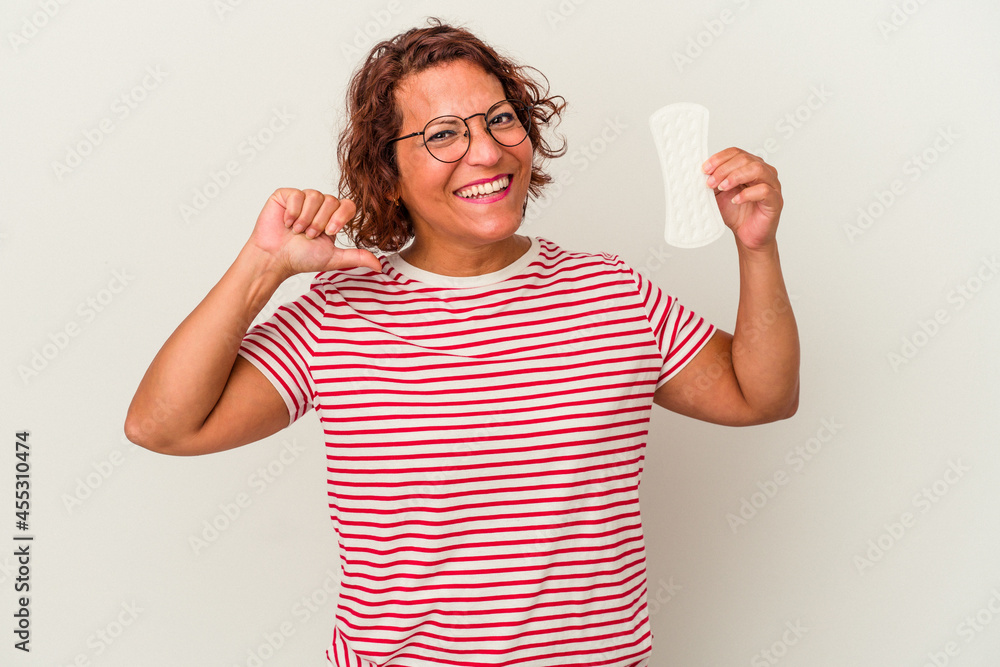 Middle age woman holding a compress isolated on white background feels proud and self confident, example to follow. Middle age woman holding a compress isolated on white background feels proud and self confident, example to follow.
