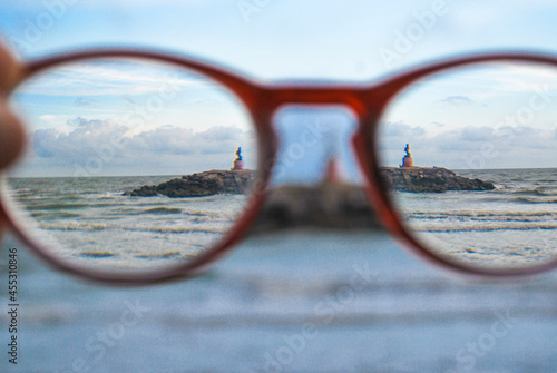 Looking at the sea and sky through glasses