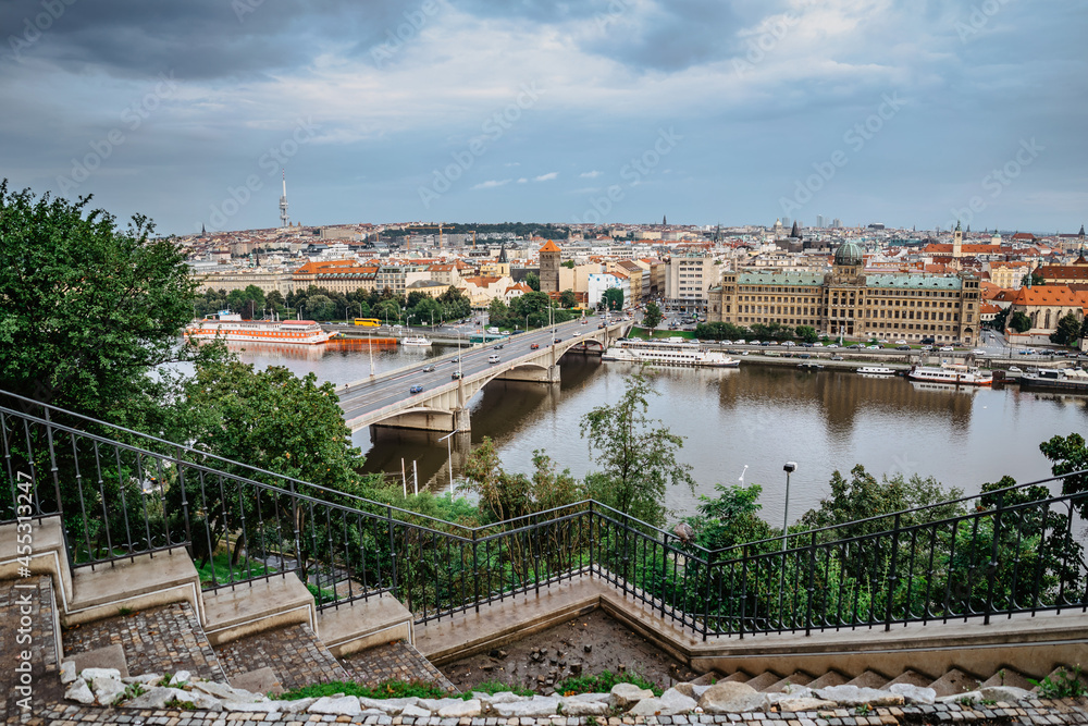 View of Prague from Letna Park,Czech Republic.Prague panorama on cloudy rainy day.Amazing European cityscape.Red roofs,TV tower,Vltava river,historical houses.Travel urban scene.Beautiful sightseeing.