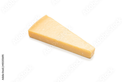 Half of parmigiano cheese isolated on a white background.
