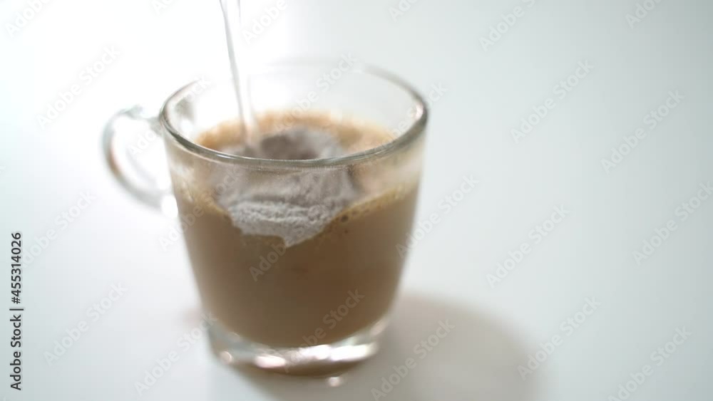 Making instant coffee drink in a glass cup with hot water Making instant coffee drink in a glass cup with hot water