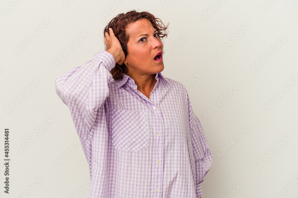 Middle age latin woman isolated on white background being shocked, she has remembered important meeting. Middle age latin woman isolated on white background being shocked, she has remembered important meeting.