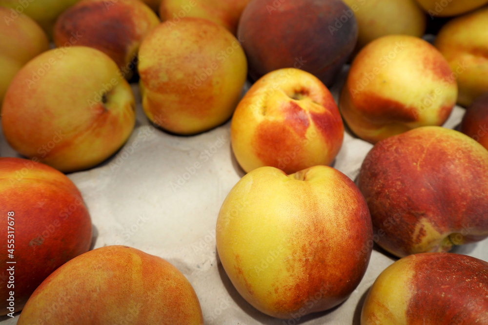 juicy ripe nectarine in a box in the supermarket . side view juicy ripe nectarine in a box in the supermarket . side view